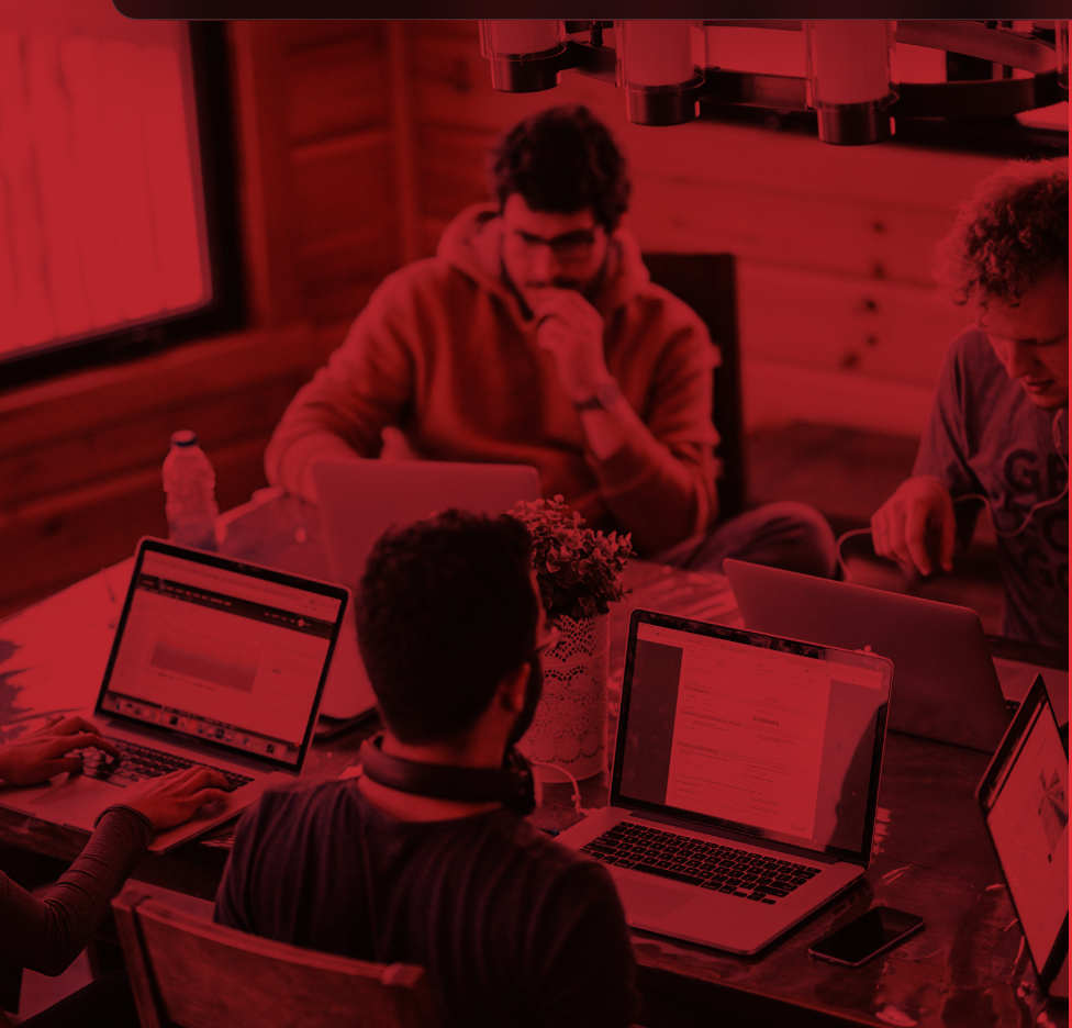 A technology team working together around a table